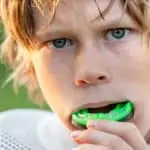 youth footballer wearing mouthguard