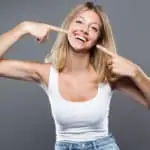 woman pointing at smile